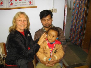 Audiologist Sue taking ear impressions