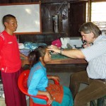 Dr Detlev Gueck checking eyes