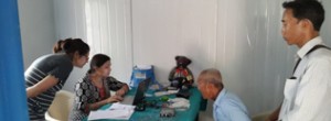 Kamala & Saraswoti fitting a hearing aid